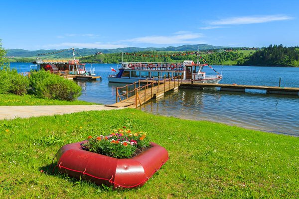 Tourist boat on Czorsztynskie lake in spring landscape of Poland