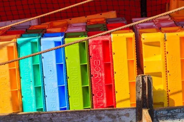 LEBA, POLAND - JUN 10, 2013: colourful stack of fish crates on vessel in Leba harbour. Leba is home town to many fishermen on Baltic Sea coast.