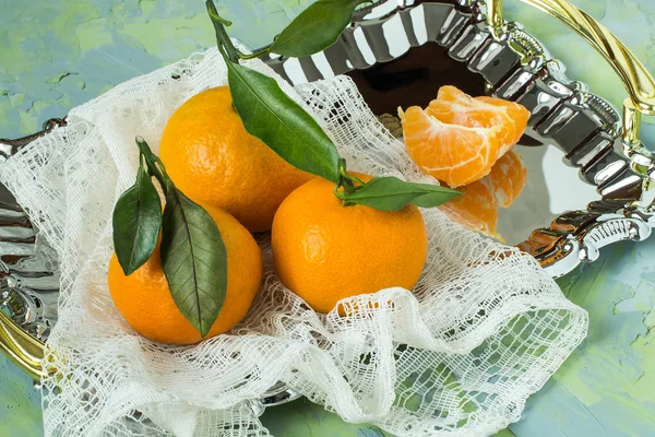 Tray with tangerines and lacy napkin — Stock Photo, Image