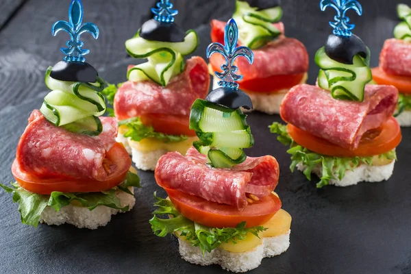 Canape on skewers with vegetables and sausage — Stock Photo, Image