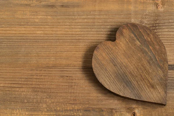 Vintage wooden heart on old wooden background — Stock Photo, Image