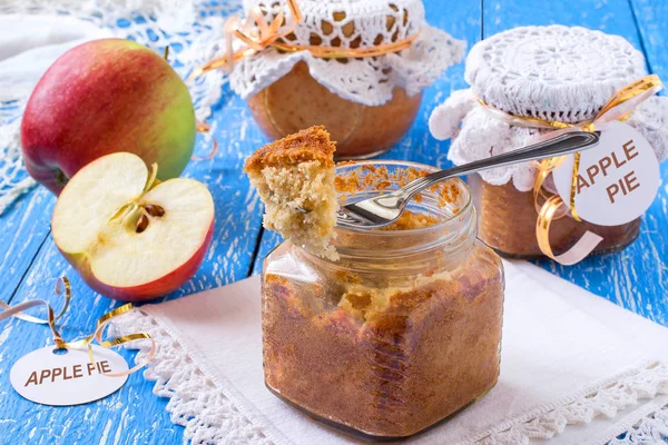 Pie with caramelized apples in jars