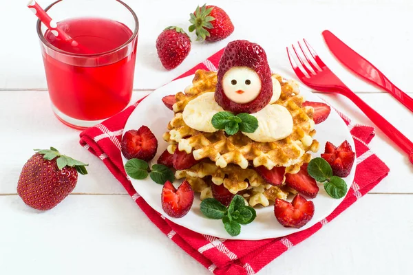 Wafers with cream cheese and strawberries in form of funny doll