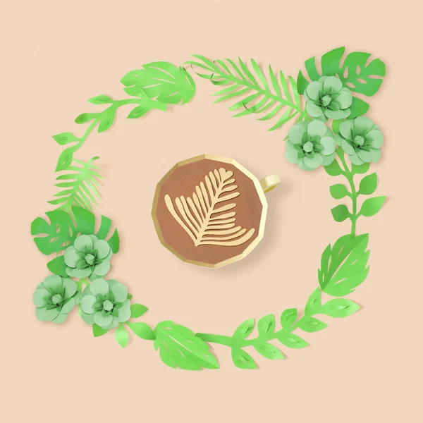 Paper cup in wreath of green leaves