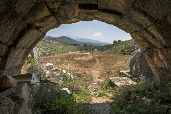 A view from the western entrance tunnel of the stadium at the ancient site of Aphrodisias in Turkey. The stadium was 270 metres long with seating for 30000 people.