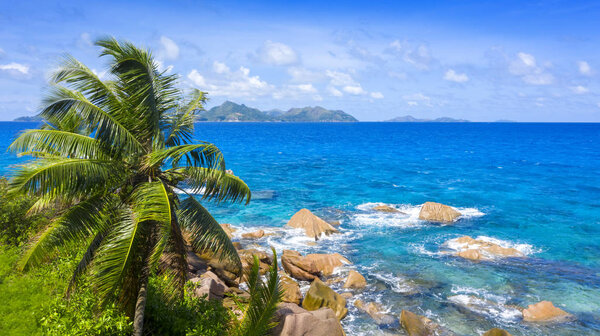Tropical regions of the planet. Seyshelles. Shooting from the drone. Pure turquoise waters of the ocean. White coral sand and blue lagoons.