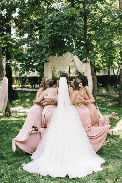 Bride Hugging Bridesmaids Royalty Free Stock Images