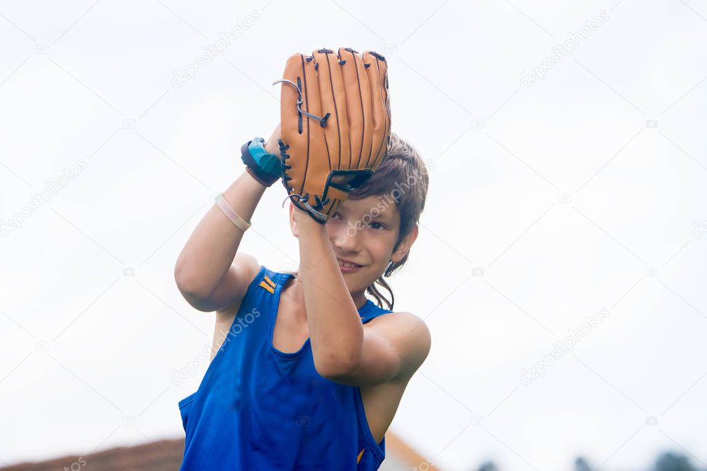 young preteen boy playing softball 