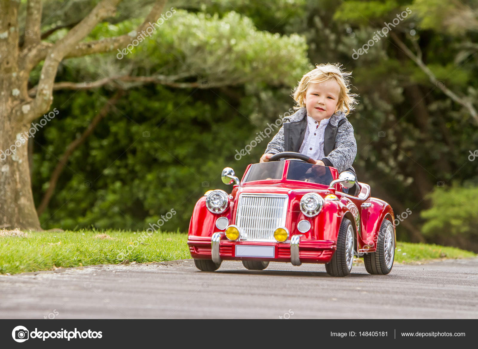 boy driving toy car