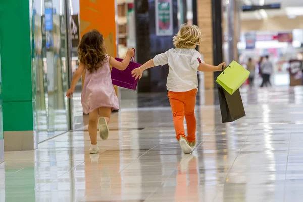 Kids shopping. cute little girl and boy on shopping. — Stock Photo, Image