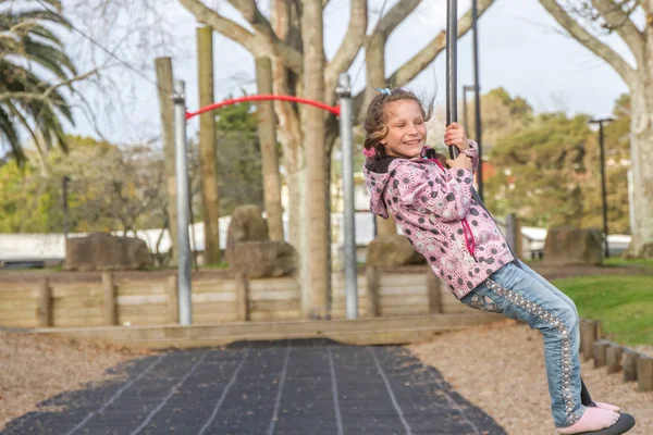 Happy Child blond girl rids on Flying Fox — Stock Photo, Image