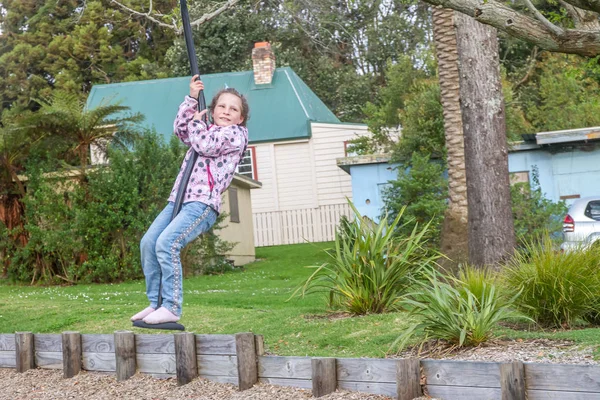 Happy Child blond girl rids on Flying Fox — Stock Photo, Image