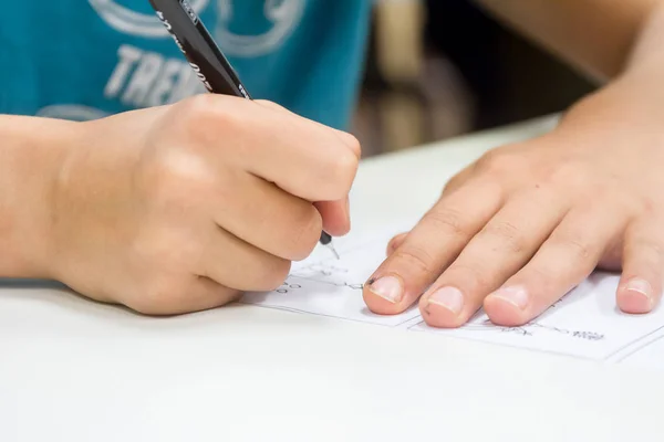 Boy drawing on white paper — Stock Photo, Image