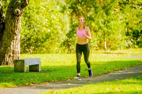 Runner jogging in summer park