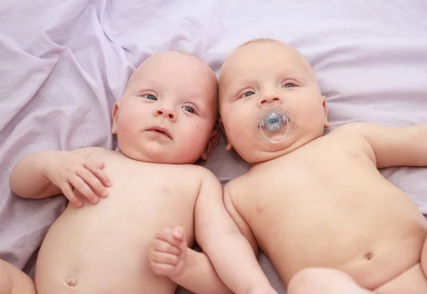 Indoor portrait of baby twins — Stock Photo, Image