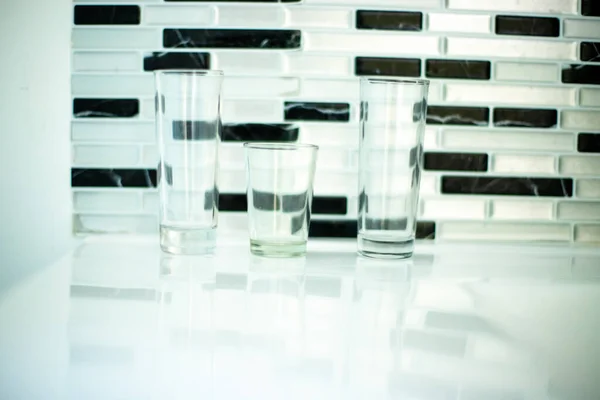 abstract shot of glasses in black and white wall geometric background