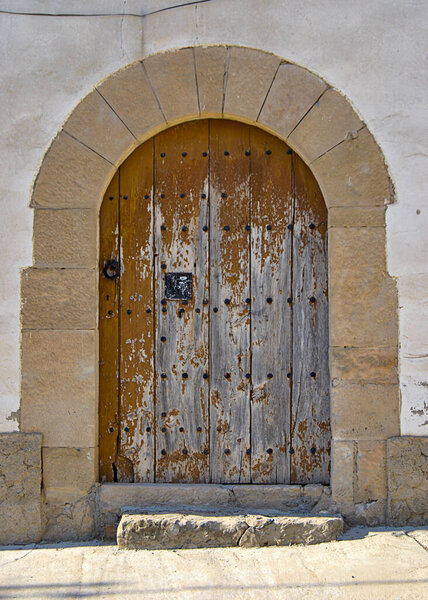 Colorful wooden door from an european country. Old, picturesque and ancient door.