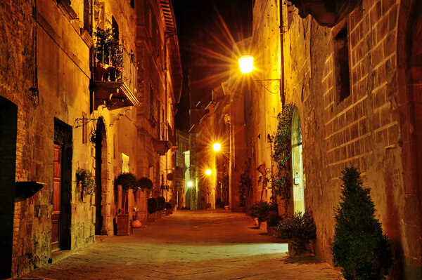 Night view of a characteristic narrow street in Pienza, Tuscany, Italy, Europe
