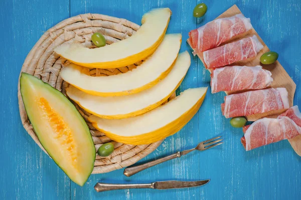 Mediterranean food - ham, melon and olives — Stock Photo, Image