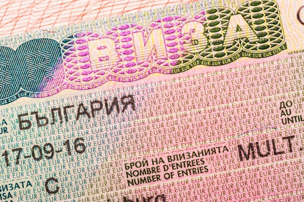 Bulgarian visa stamp in a passport, closeup, selective focus.