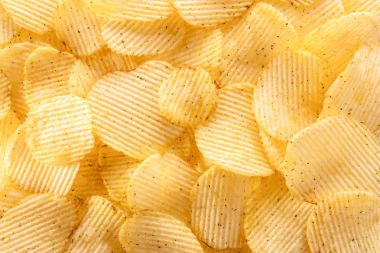 Patates cipsi arka plan güneş ışığı altında.