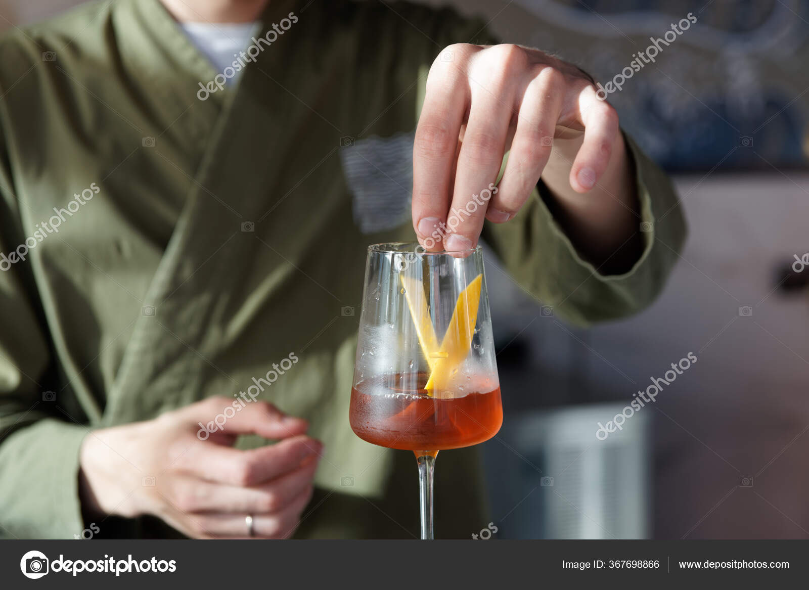 Male Bartender Adding Lemon Zest Cocktail Winegglass — Stock Photo © Serreitor 367698866