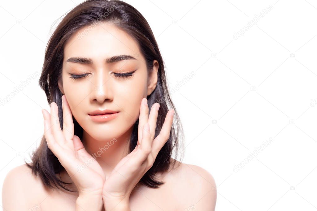Beautiful young asian woman close eyes and touching her beauty face. Gorgeous girl has nice, perfect face skin with natural makeup. Secret of beauty skin is sleep early at night. Skin care concept