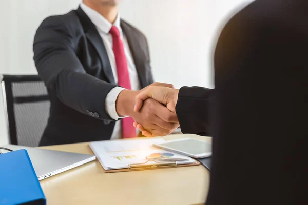 Businessman shake hand with customer for dealing contract or greeting. Boss employ worker that he get headhunter of professional businessperson from another company. Worker get job and ready for work