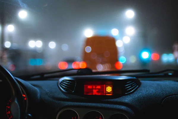 Night time car driving coloured city light streaks long exposure — ストック写真
