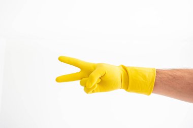 White Caucasian male hand with yellow latex glove showing showin