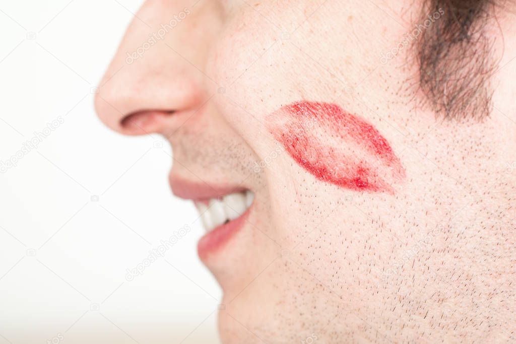 Caucasian white male man cheeks with red lipstick kiss marks smi