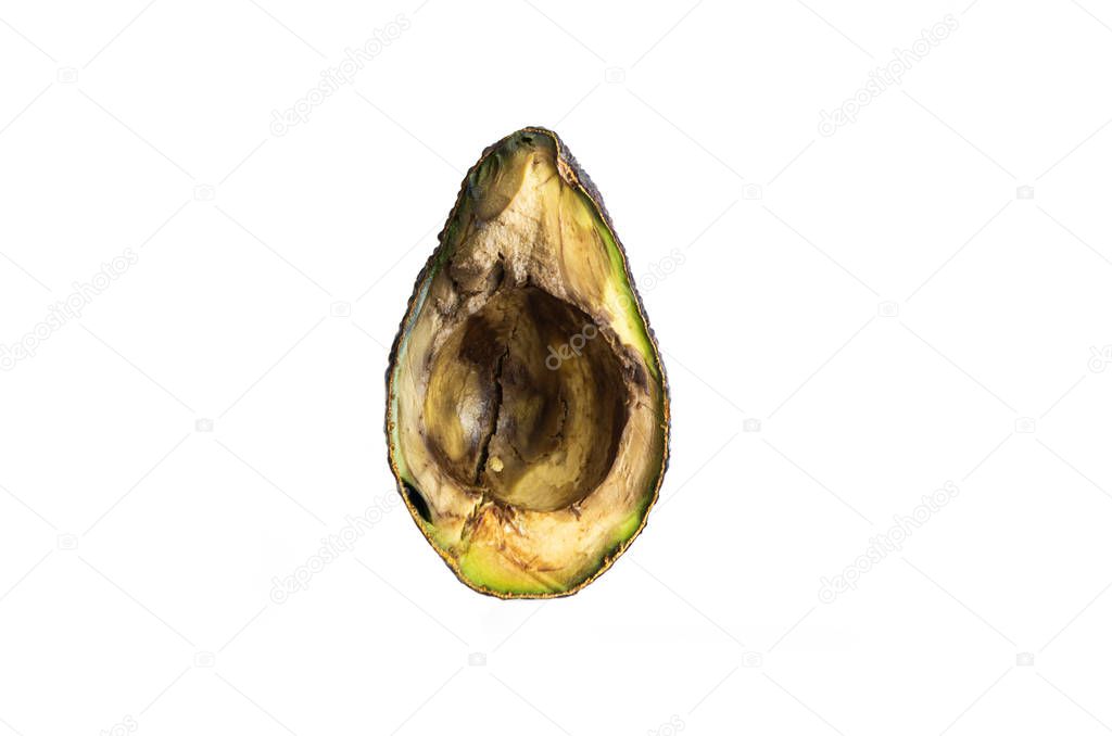 Halved rotten spoiled avocado fruit macro close up shot isolated on pure white 2020