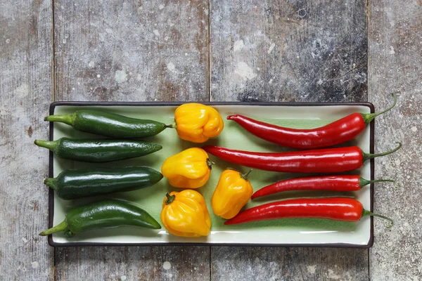 Close Red Green Yellow Hot Peppers Arranged Rectangular Tray Old — Stock Photo, Image