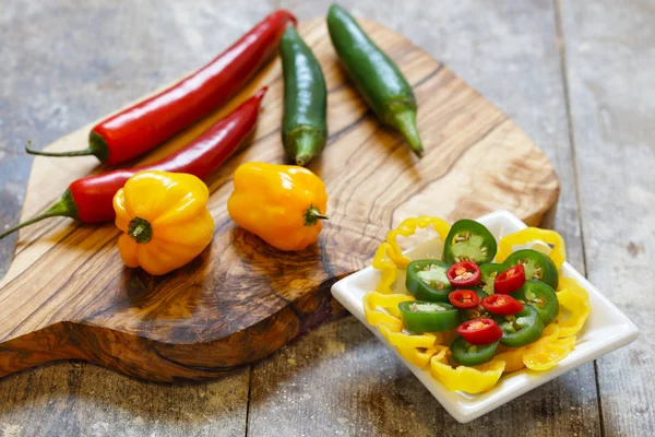 Red Green Yellow Hot Peppers Wooden Board Sliced Peppers White — Stock Photo, Image