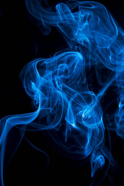 Abstract shape of blue smoke on black background.