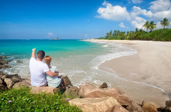 Couple tourists resting during summer vacation on beach of island Sri Lanka. — Stok fotoğraf