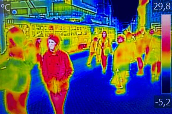 Infrared Thermal image people walking the city streets