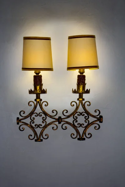 Old wall lamp made of metal with shade from canvas — Stock Photo, Image