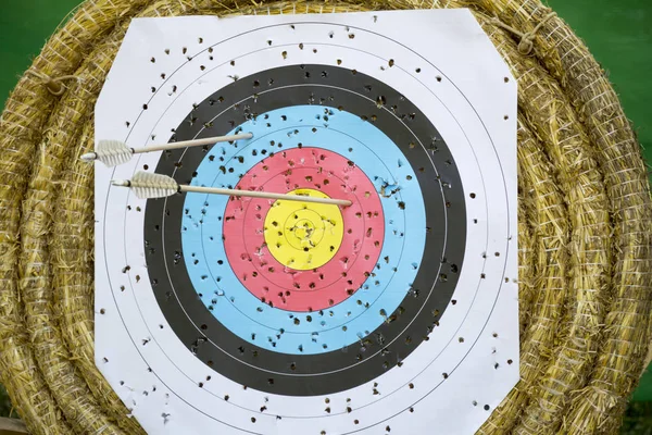 Archery Target With Arrows On a straw background