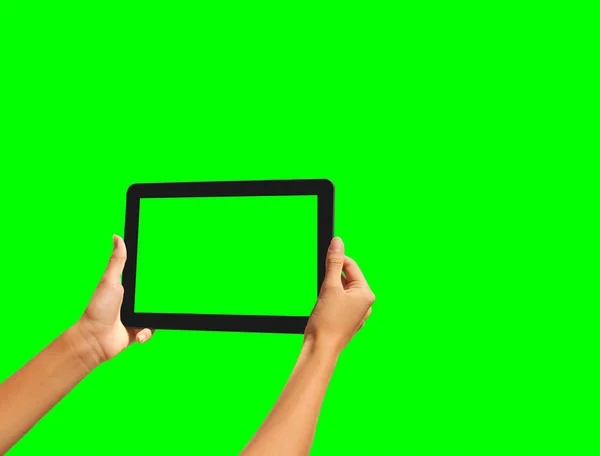 Young girl hand holding a tablet on green screen — Stock Photo, Image