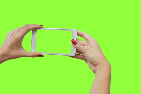 Young girl hand holding mobile smart phone on green screen — Stock Photo, Image