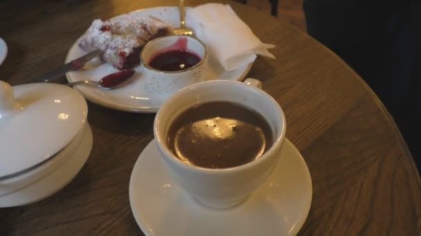 Cup of coffee and a slice of cherry cake — Stock Video