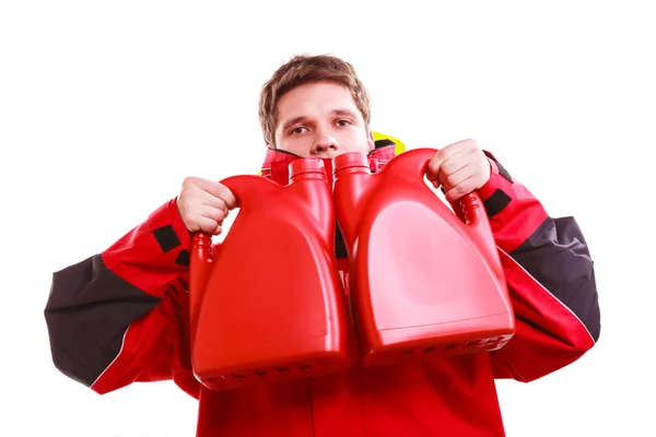 Man in oilskin with bottle. — Stock Photo, Image