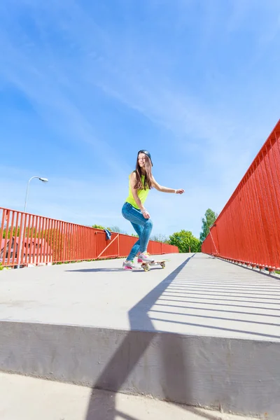 Teen girl skater riding skateboard on street. — Stock Photo, Image