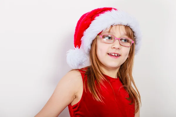 Kleines Mädchen sieht aus wie Weihnachtselfe. — Stockfoto
