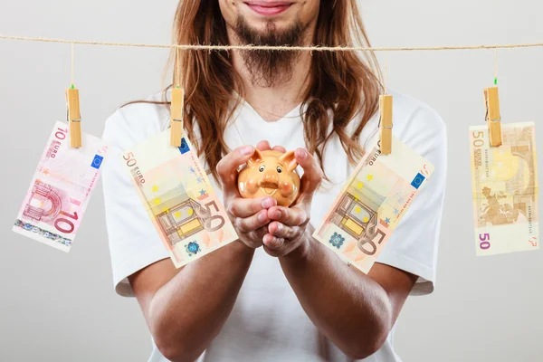 Man holding moneybox piggybank — Stock Photo, Image