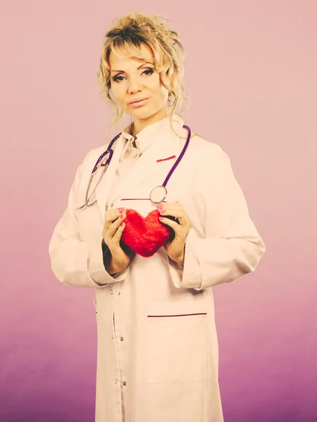 Female doctor with heart. — Stock Photo, Image