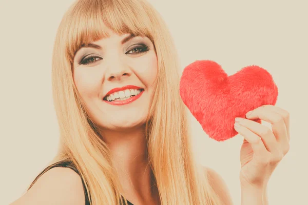 Woman gorgeous girl holding red heart love symbol — Stock Photo, Image