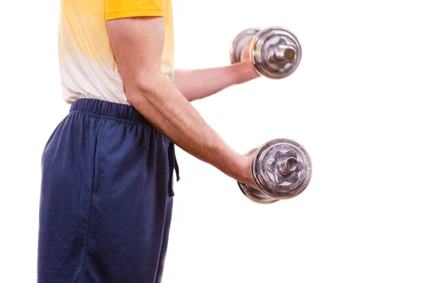 Man exercising with dumbbells lifting weights Stock Image