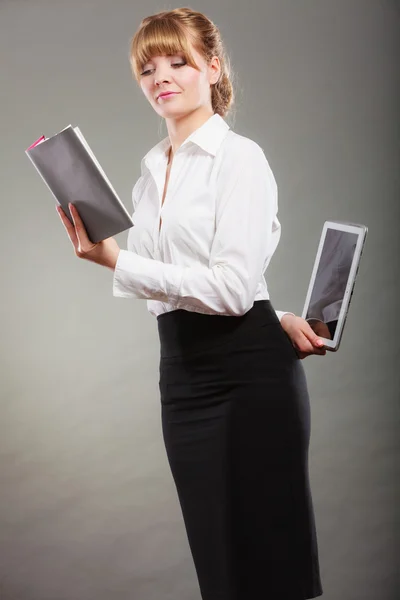 Woman learning with ebook and book. Education. Royalty Free Stock Images